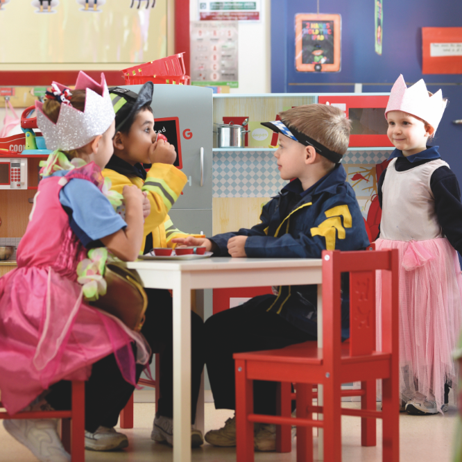 Early Learning students playing with costumes