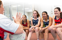 Netball students with coach