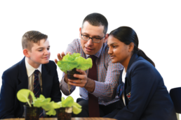 Science Engineering teacher with students